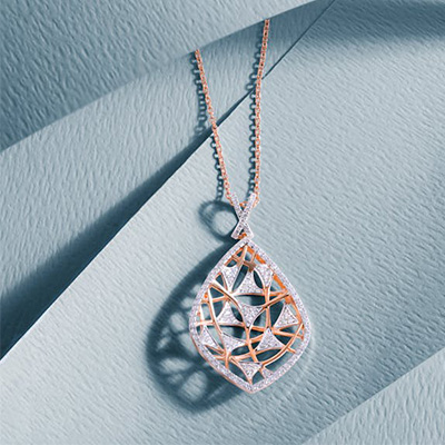 Geometric diamond filigree necklace with intricate open metalwork and sparkling diamond accents
